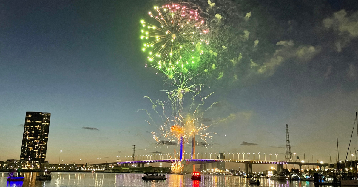 New Year's Eve fireworks over Victoria Harbour, Docklands Melbourne, with Bolte Bridge in the background