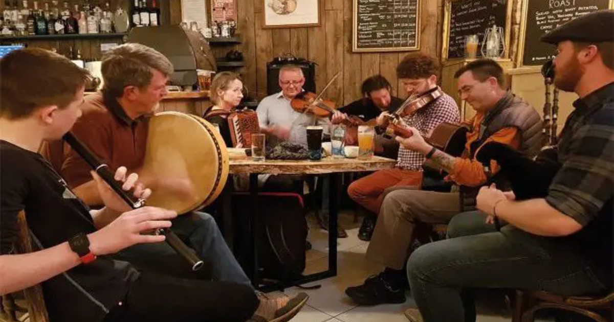 Traditional Scottish music session at Invergordon Bar with pints and drams