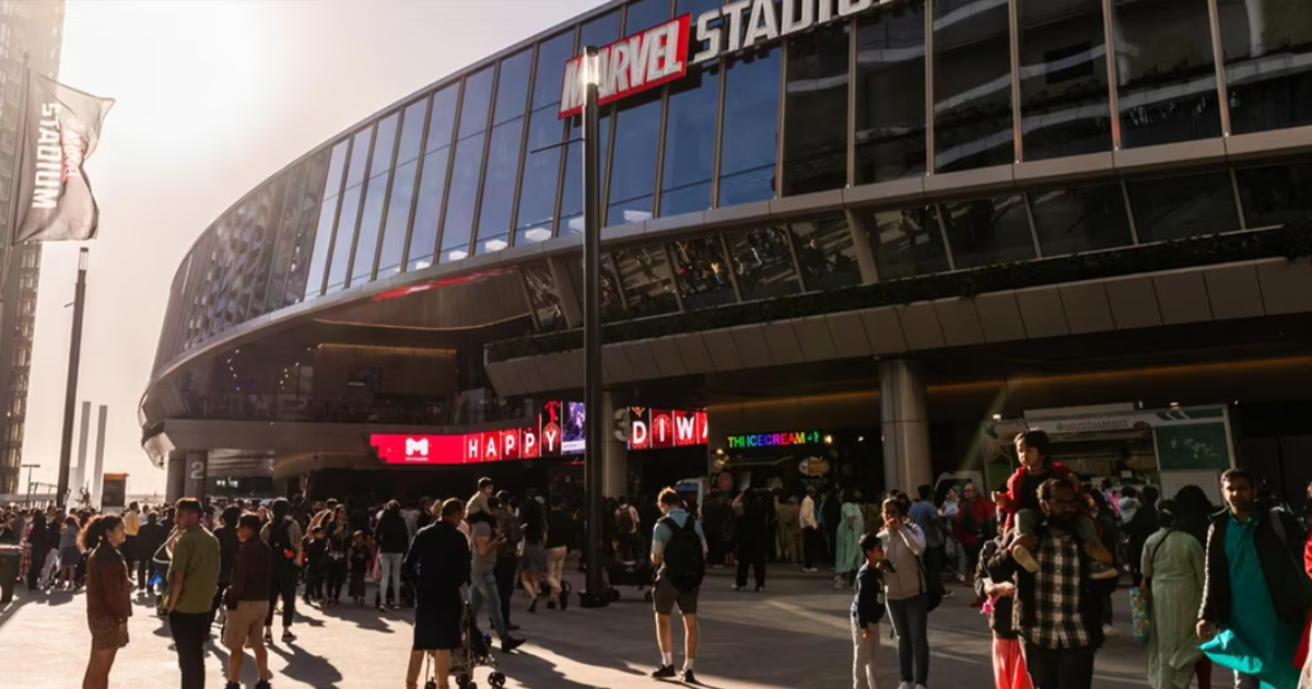 Crowds gathered outside Marvel Stadium in Docklands, Melbourne on a sunny event day.