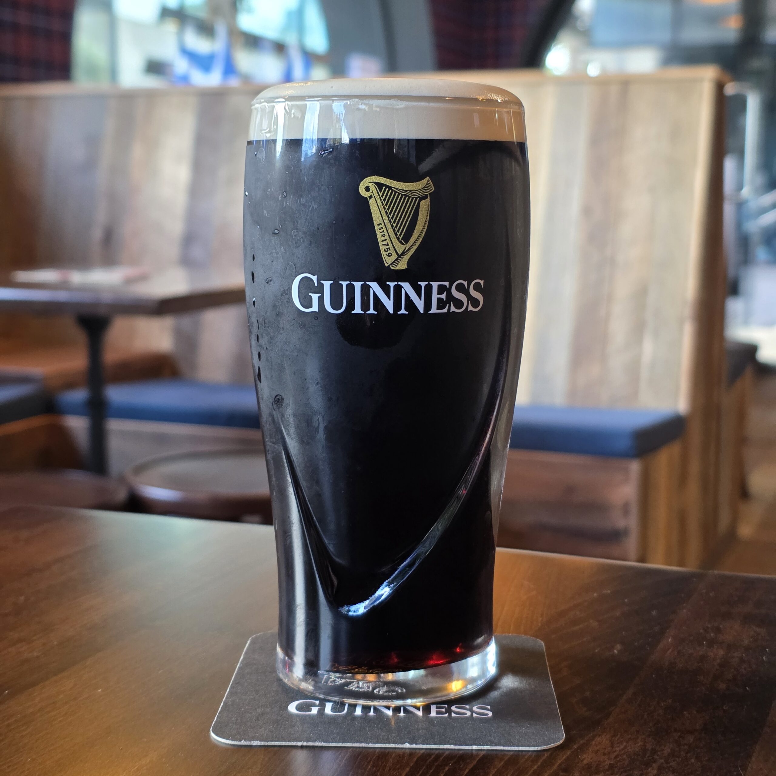 A perfectly poured pint of Guinness with a thick creamy dome at Invergordon Bar, Docklands.